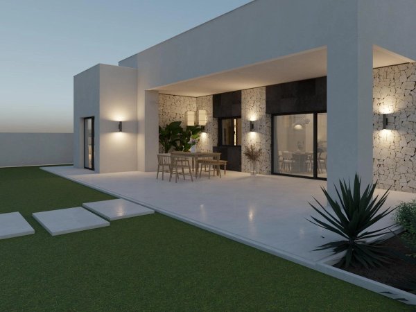 Exterior view of a contemporary 3-bed villa in Pinoso, featuring a spacious terrace and green lawn.