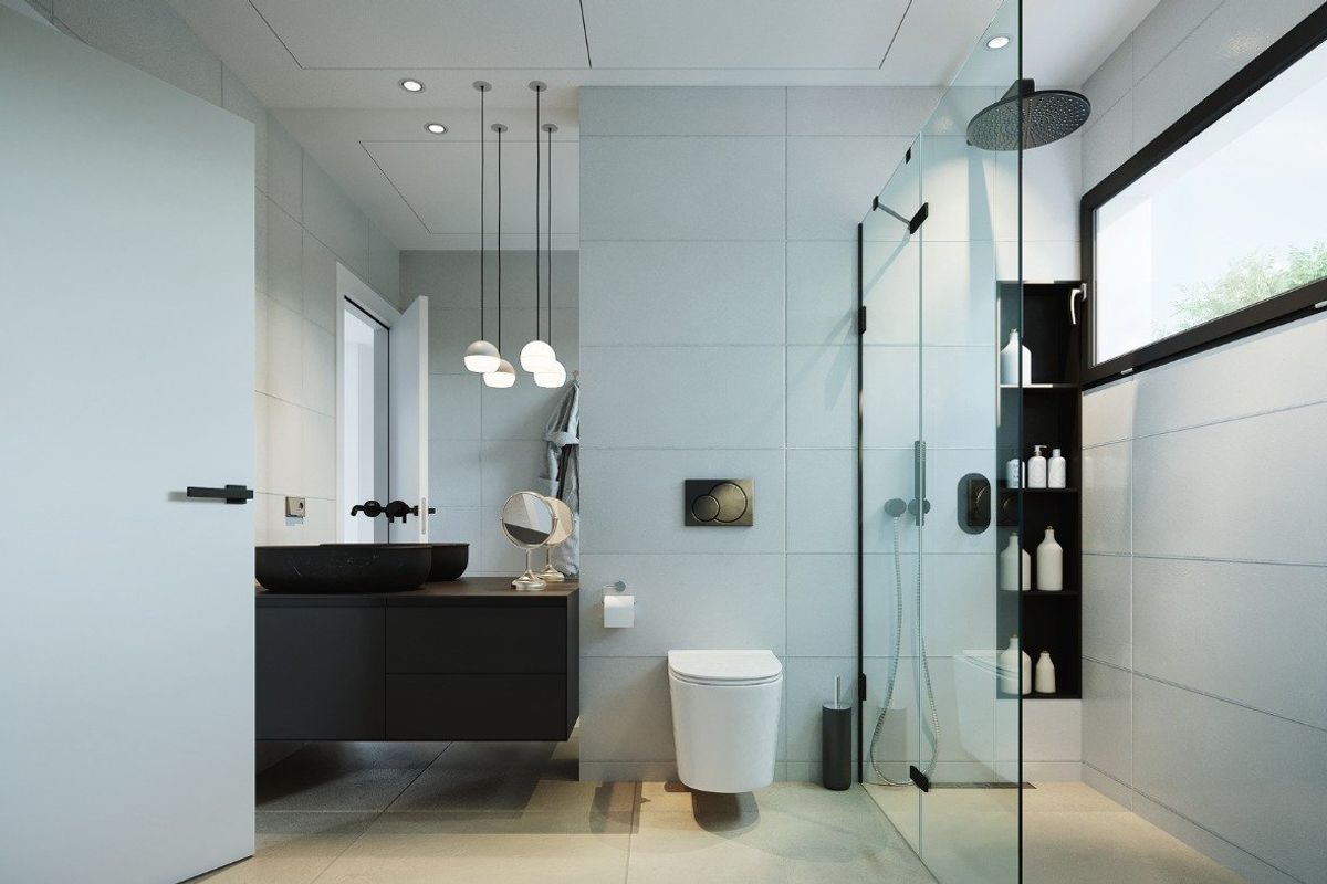 Stijlvolle badkamer met moderne armaturen in een villa, met een glazen douche en eigentijds ontwerp.