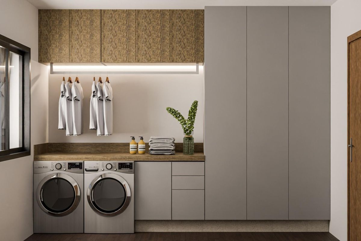 Laundry room in a Pinoso villa, equipped with modern appliances, cabinetry, and ample storage.