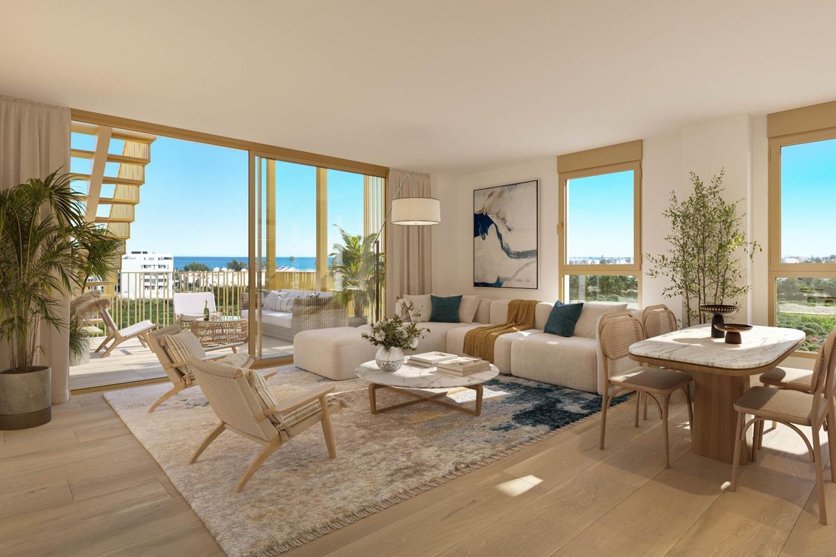 Heldere woonkamer met moderne inrichting en uitzicht op de oceaan, onderdeel van een 2-slaapkamer appartement in El Verger, Costa Blanca Noord, Spanje.