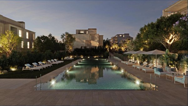 Evening view of a luxurious swimming pool at a penthouse property in Godella, Costa Blanca North, Spain.