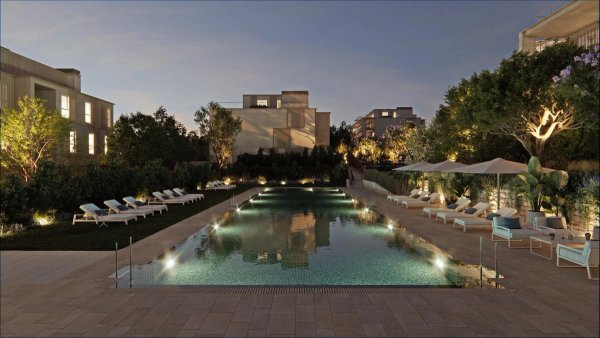 Evening view of a luxurious swimming pool at a penthouse property in Godella, Costa Blanca North, Spain.