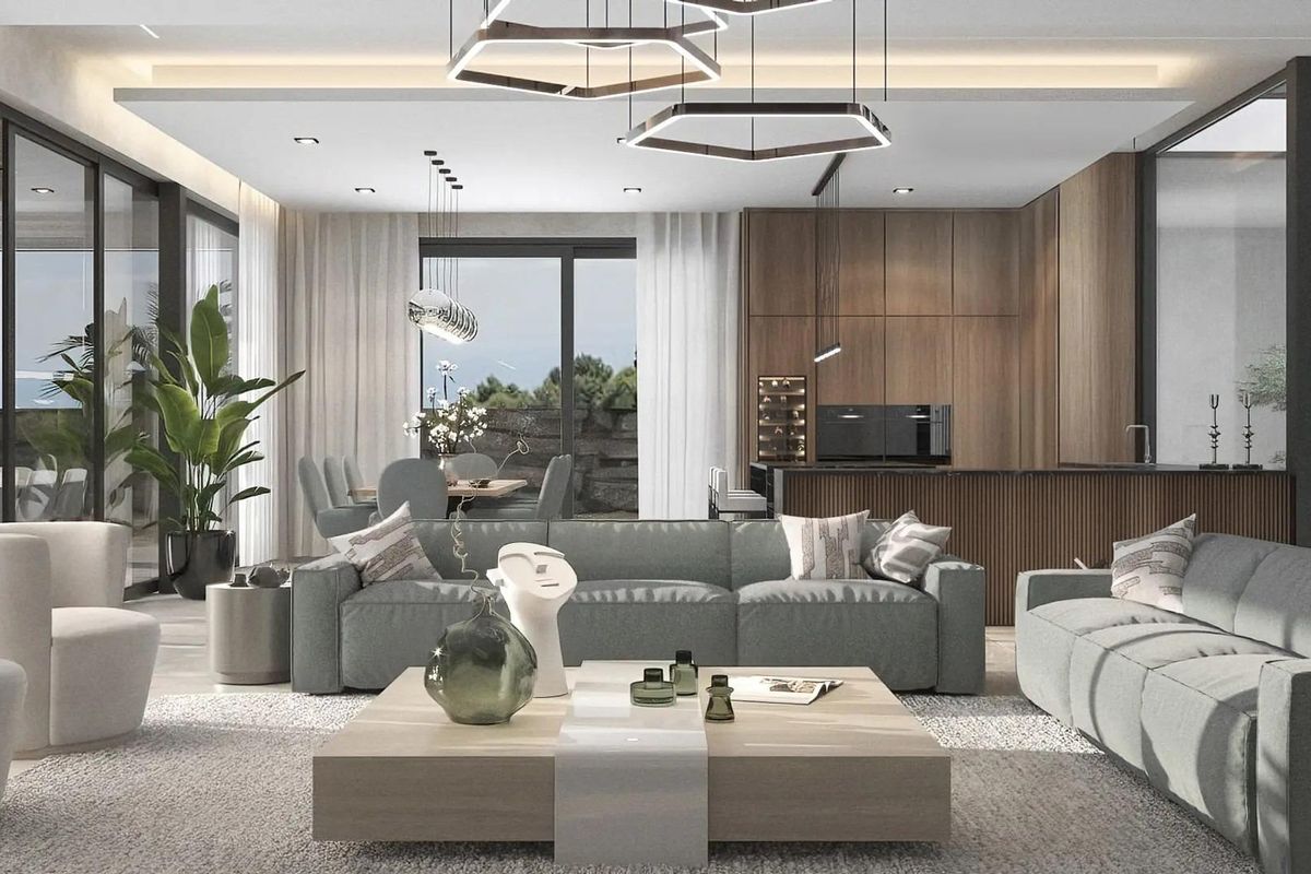 Ruime woonkamer met moderne inrichting, eetruimte en uitzicht op groen in een villa in Benahavís.