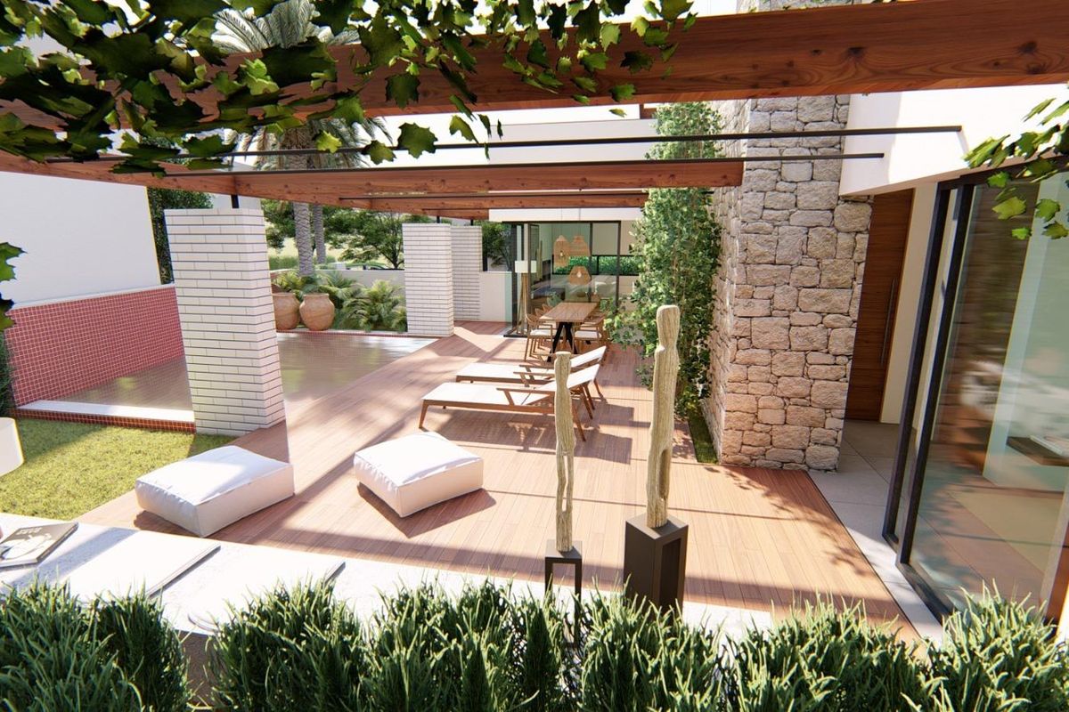 Terras van een villa in Torre Pacheco, met ligstoelen en uitzicht op de tuin en het zwembad.