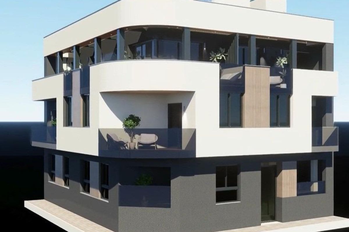 Stijlvolle gevel van een modern 2-slaapkamer penthouse gebouw met balkons en groen, gelegen in Torrevieja.