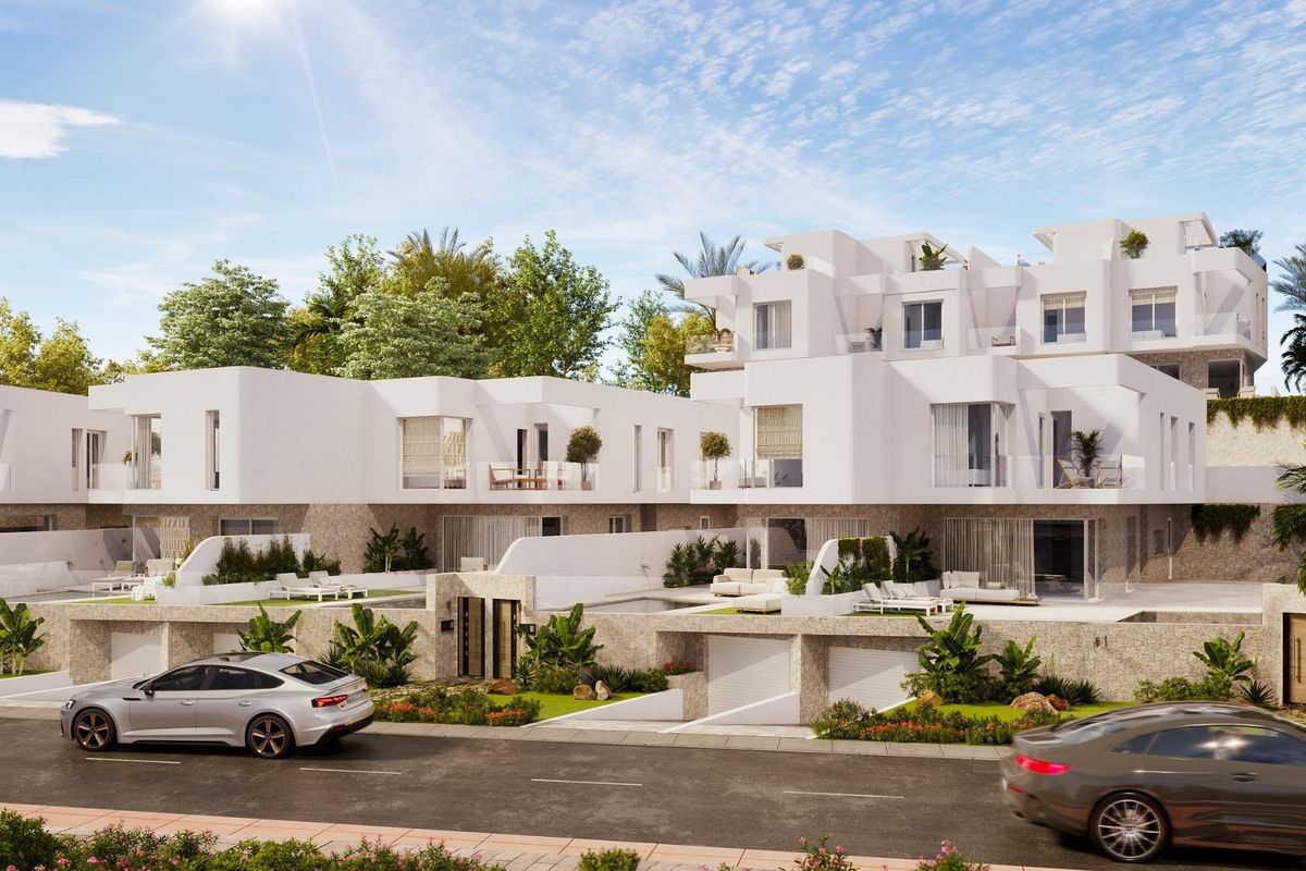 Exterieur van een moderne 3-slaapkamer townhouse in Mojacar, met tuinen en een zonnige lucht.