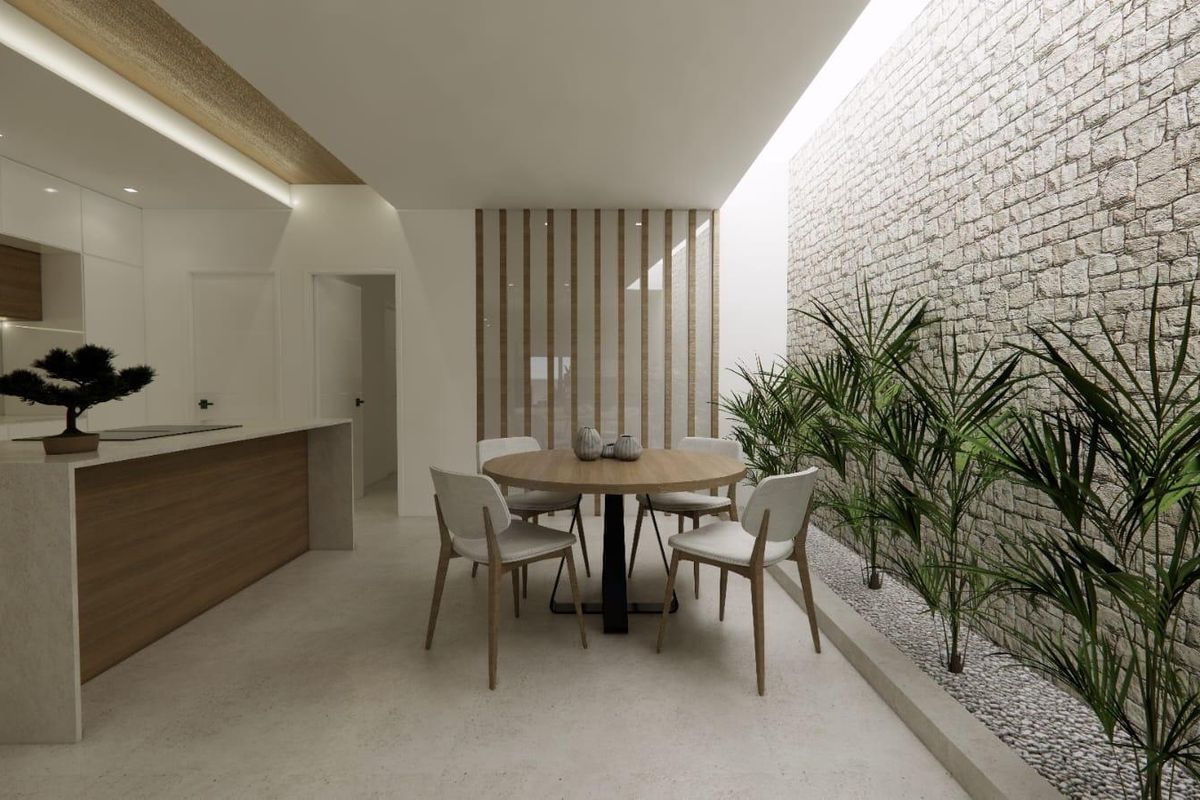 Keukenaanzicht vanuit de eetruimte in het stijlvolle appartement in Catral, met moderne afwerkingen en planten.