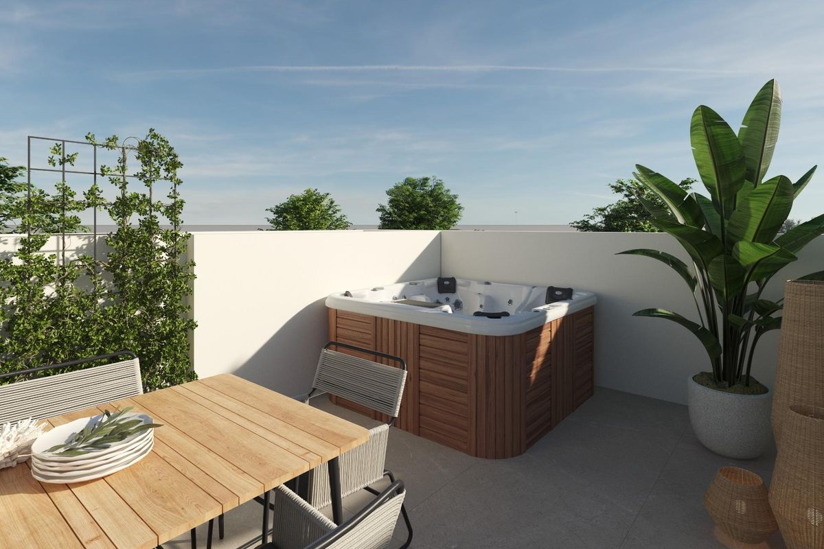 Private rooftop terrace with a hot tub and dining table at this Dolores townhouse, Costa Blanca South, Spain.