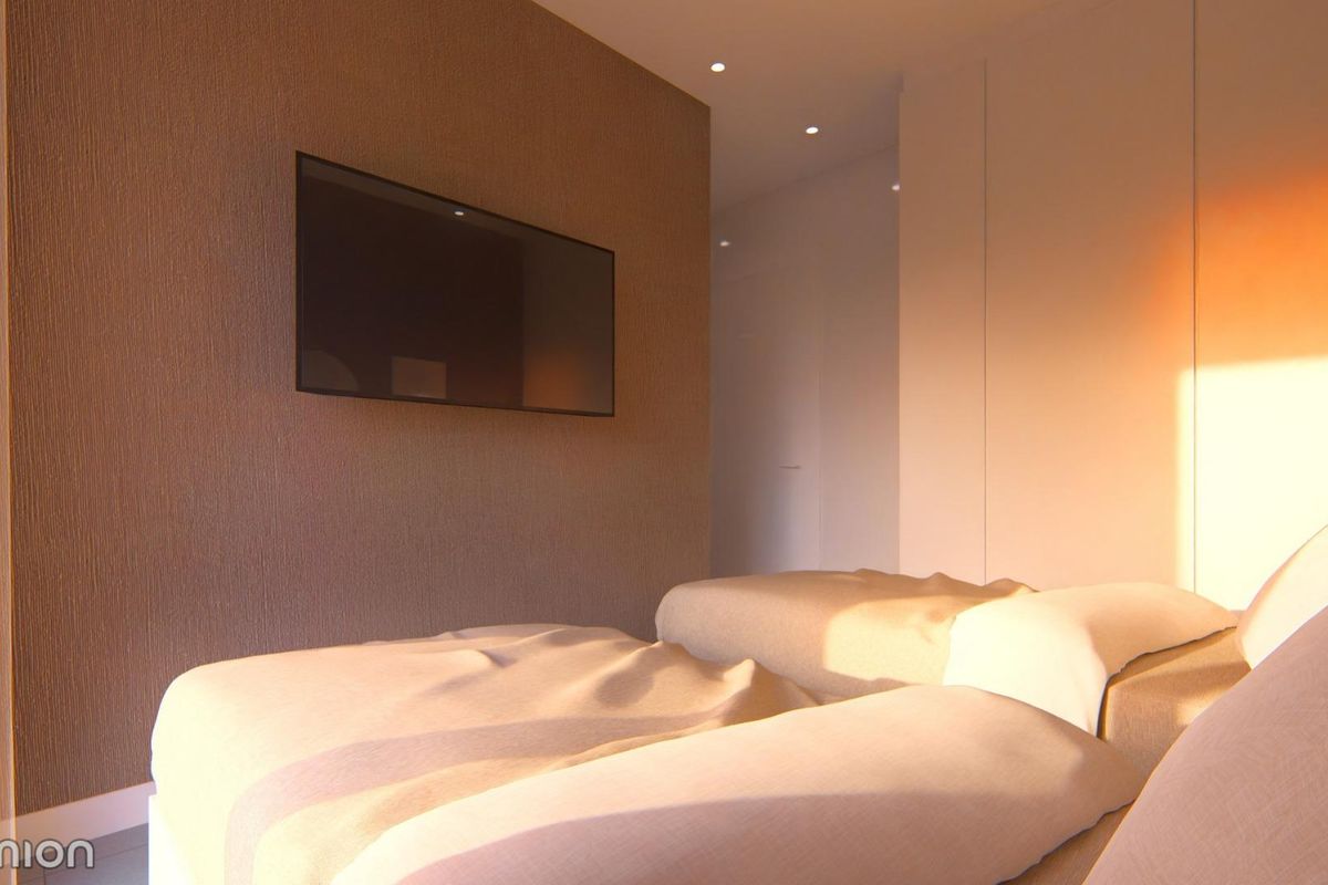 Heldere slaapkamer in een townhouse in San Javier met twee eenpersoonsbedden, ideaal voor gasten of gezinsleden.