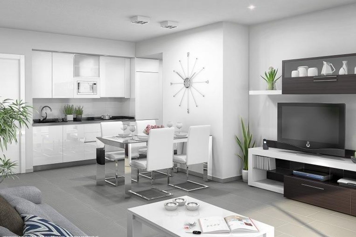 Heldere moderne woonkamer met eetruimte en strakke keuken in de bungalow, San Miguel de Salinas.