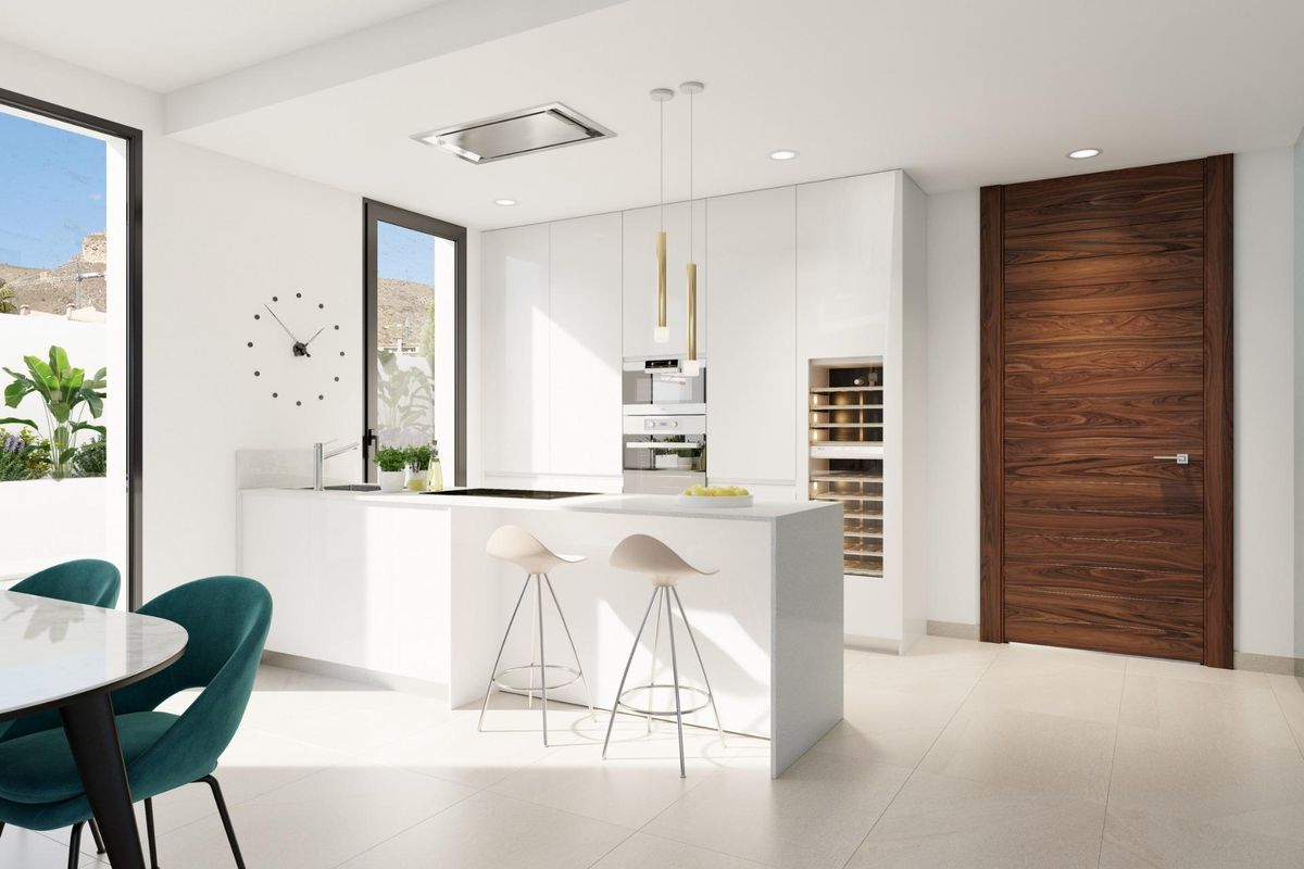 Contemporary keuken met witte kasten en eetgedeelte in een villa in Finestrat.