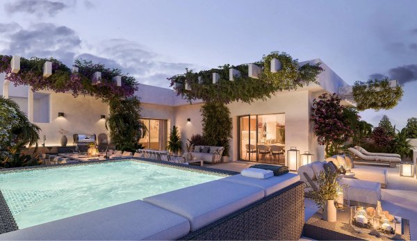 Penthouse terras met zwembad en loungegedeelte, omringd door levendige groen in Casares, Costa del Sol.