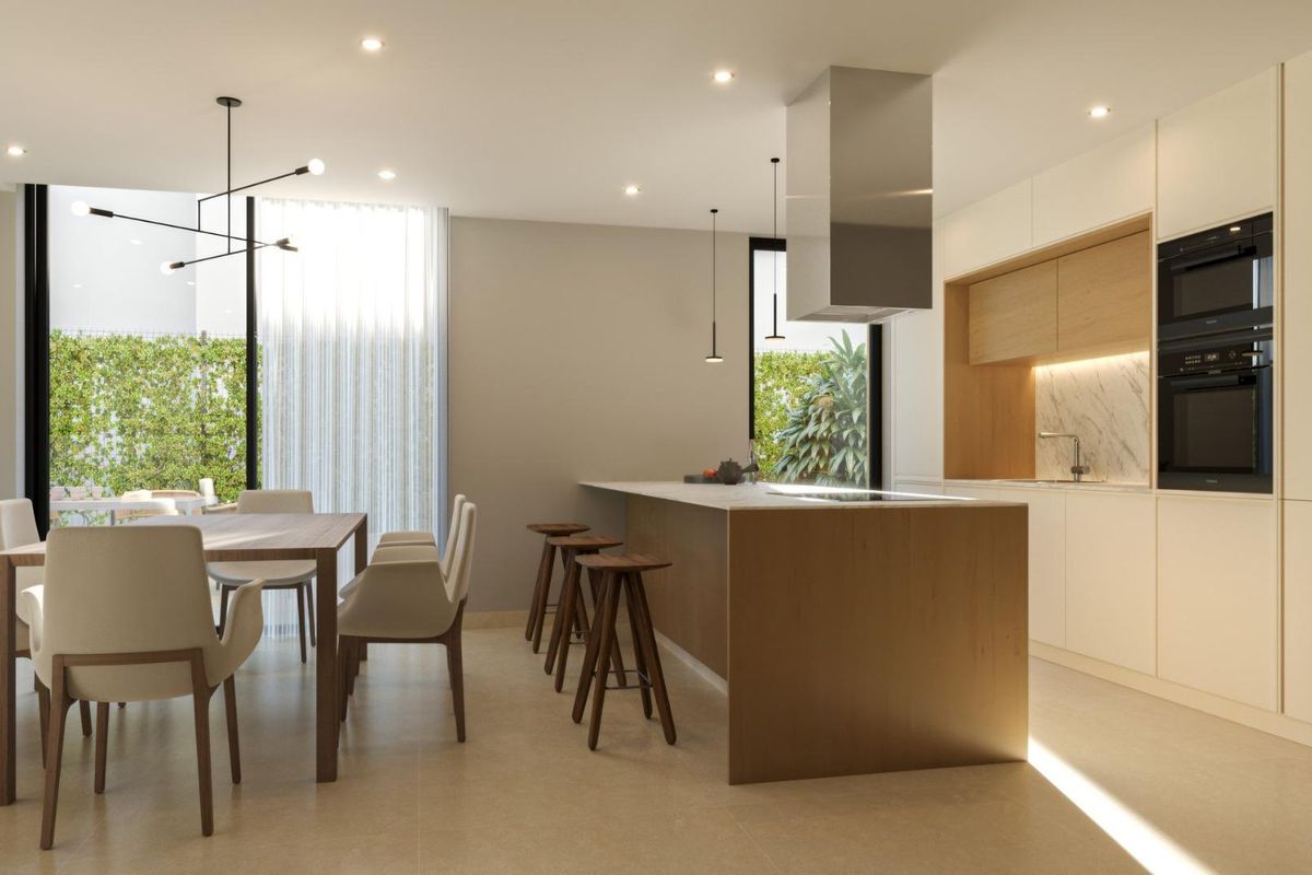 Strakke keuken in een villa in Finestrat, met moderne apparaten en een stijlvolle eetruimte.