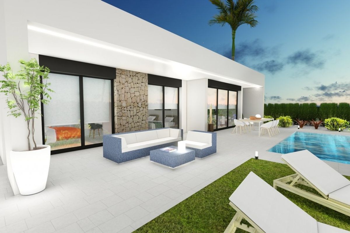 Outdoor lounge area of a 2-bed villa in Calasparra, overlooking the pool and garden.