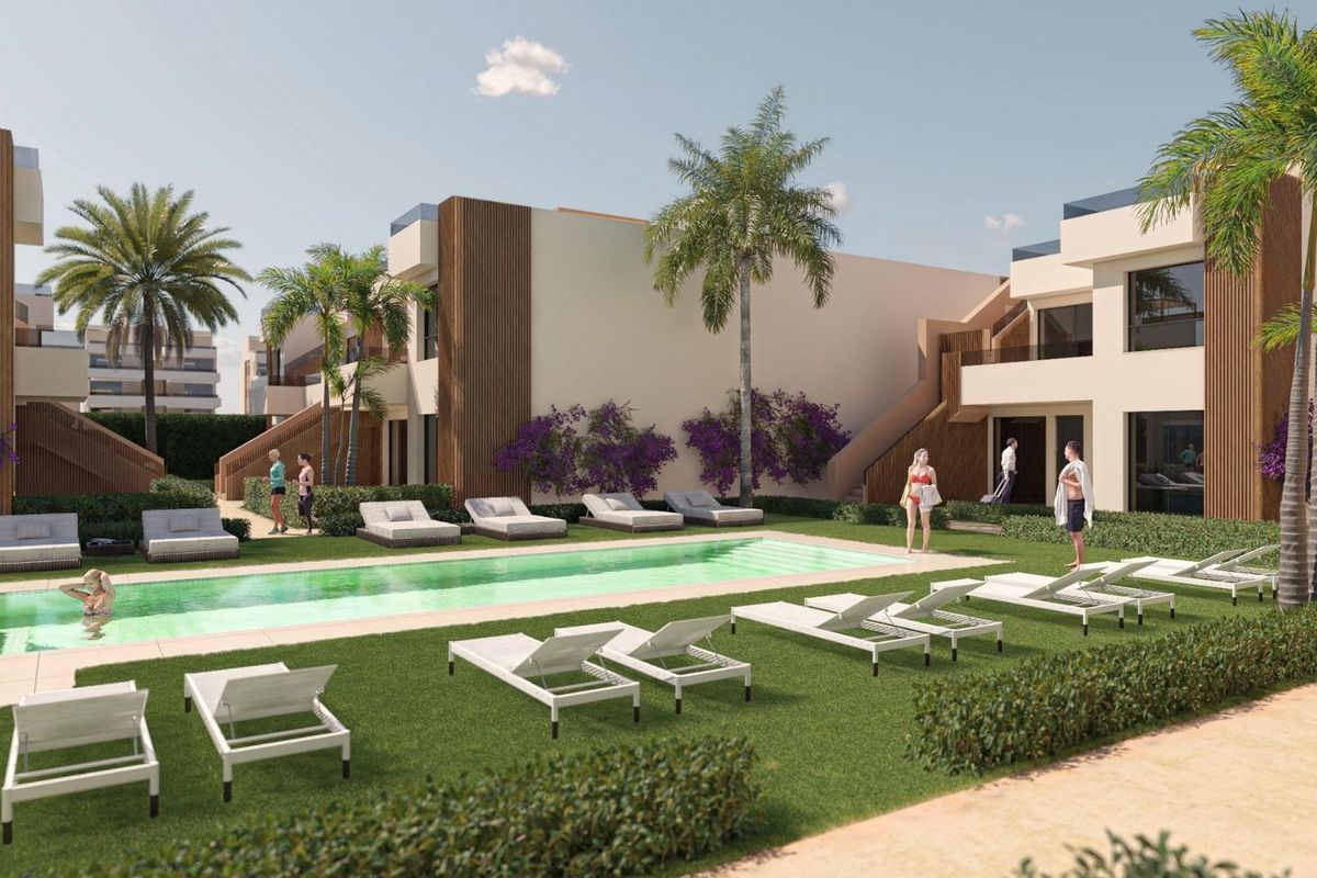 Relaxing poolside scene in Alhama De Murcia, with loungers and residents enjoying the sunny atmosphere.