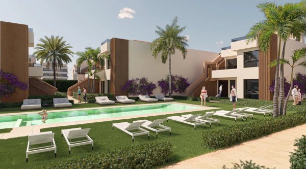 Ground floor apartment complex pool area in Alhama De Murcia, featuring lounge chairs and palm trees.