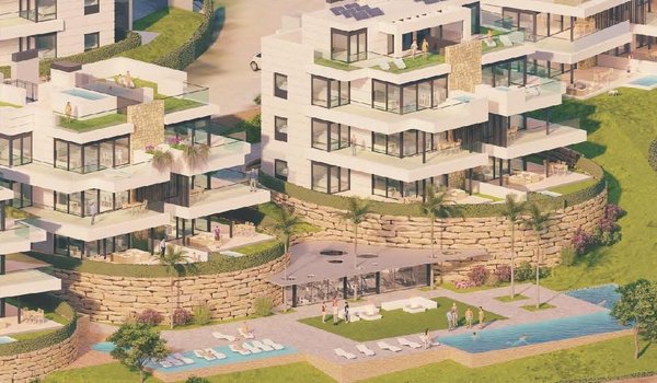 Luchtfoto van een modern appartementencomplex in Estepona, Costa del Sol met tuinen en een zwembad.