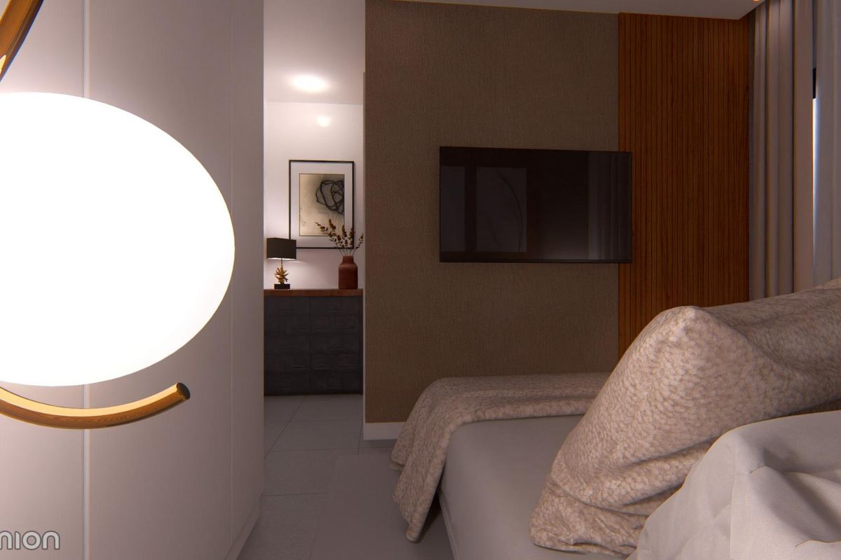 Stijlvolle en serene slaapkamer in een townhouse in San Javier, benadrukt door zachte verlichting en moderne meubels.