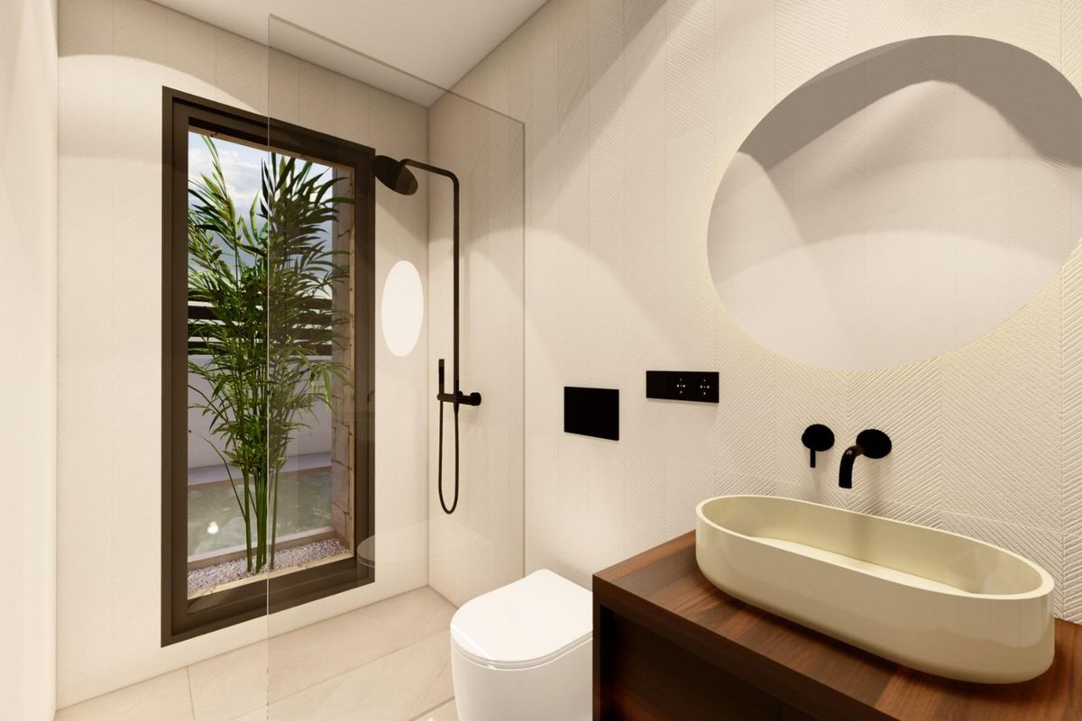 Ruime badkamer met een strakke douche en natuurlijk licht in een villa gelegen in Benijofar.