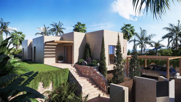 Modern 3-bed villa exterior in Jávea, Costa Blanca, surrounded by palm trees and a lush garden.