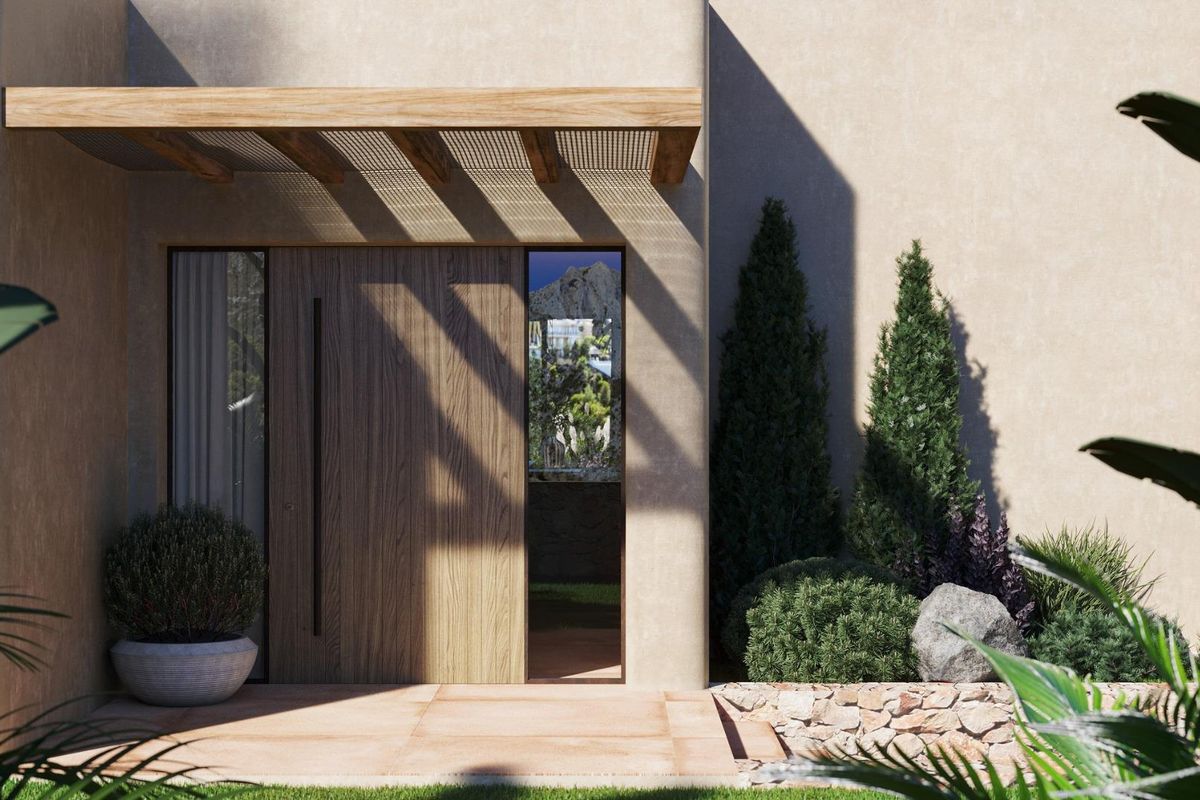 Contemporary ingang van een 3-slaapkamer villa in Jávea, met natuurlijke stenen en groen.