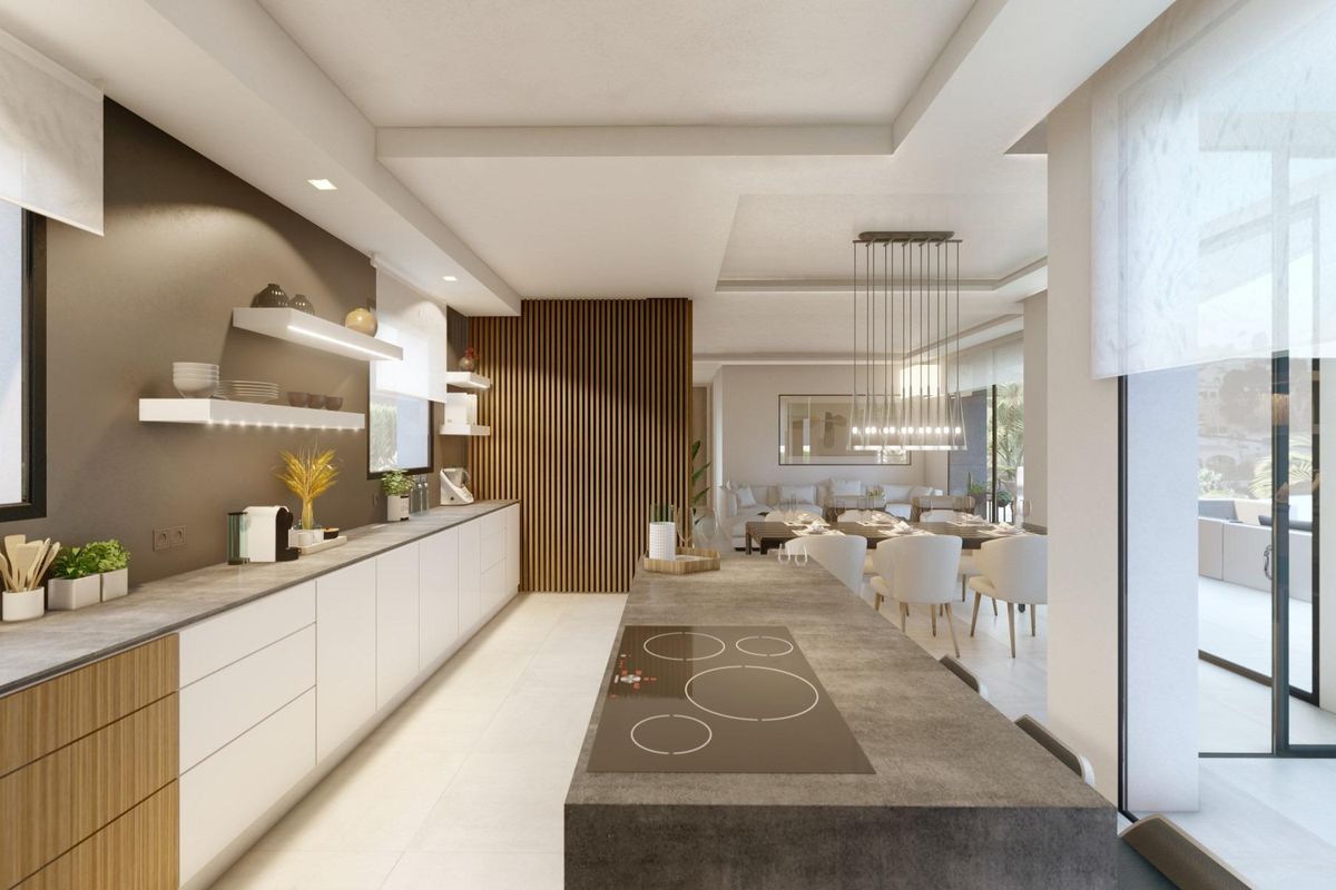 Moderne keuken met strakke afwerking in een villa met 4 slaapkamers in Benissa, met eiland en eetruimte.