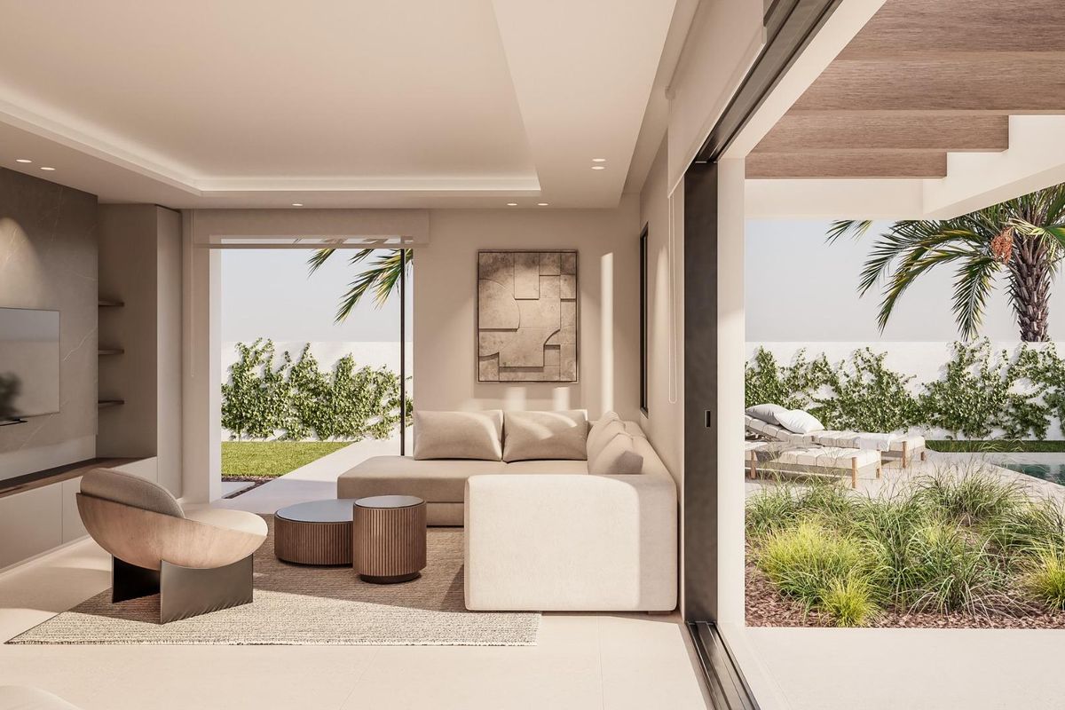 Bright living room in a 2-bed townhouse in El Campello featuring large windows and a cozy layout.