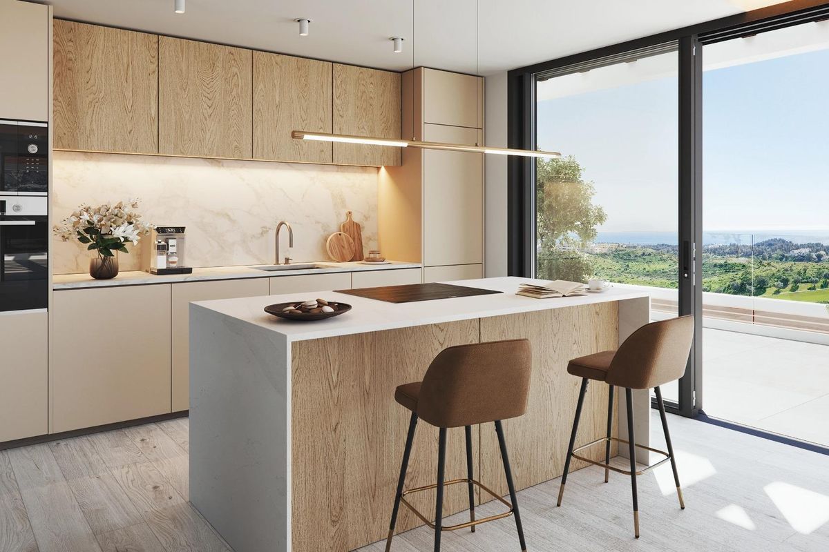 Gestroomlijnde keukendesign in een appartement in Mijas, met moderne apparaten en een prachtig uitzicht op het platteland.