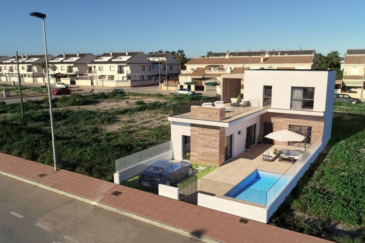 Luchtfoto van een moderne townhouse in San Javier met het zwembad en omliggende open ruimtes.