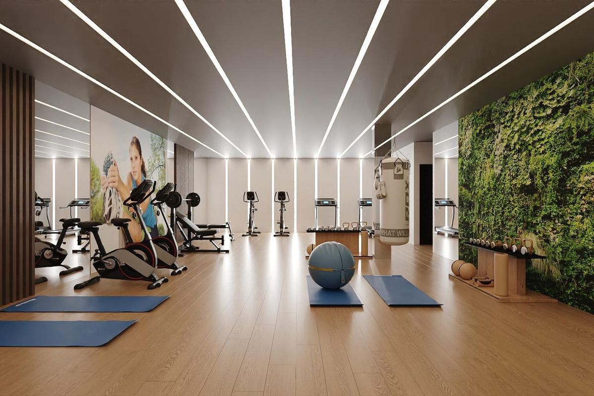 Ruime fitnessruimte uitgerust met moderne fitnessapparaten in een woning in Torre Pacheco.