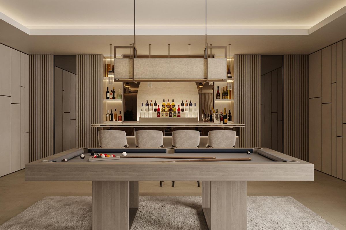 Stijlvolle biljartkamer met een bar en zitplaatsen, ontworpen voor entertainment in een luxe villa in Marbella, Costa del Sol.