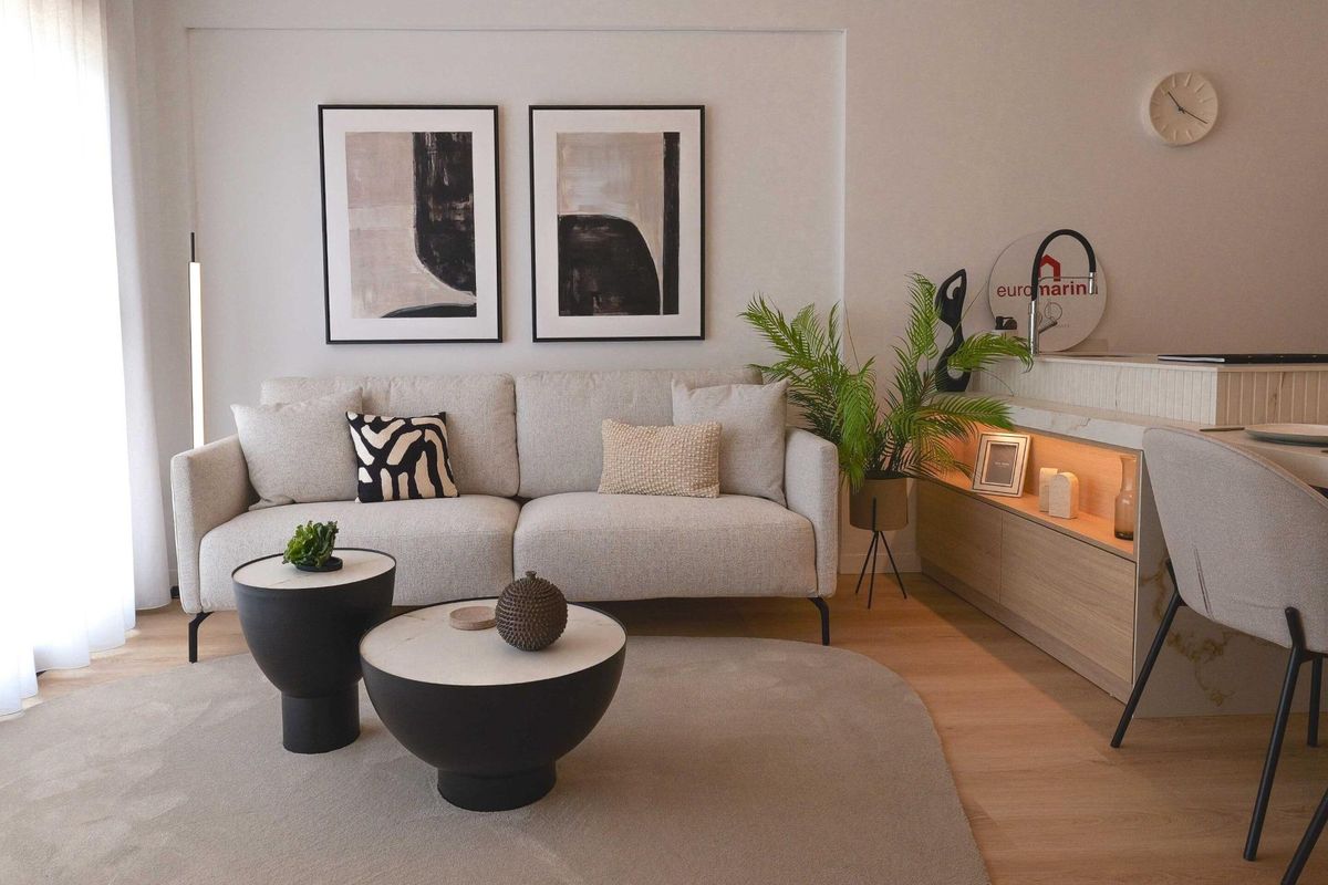 Inviting living room with artwork, modern furniture, and plants, La Manga del Mar Menor, Spain.