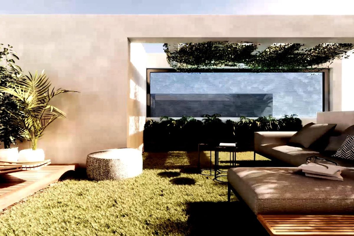 Uitnodigende buiten lounge in Torrevieja met zitplaatsen, groen en een rustgevende sfeer.