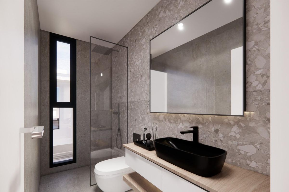 Modern badkamer in een villa in Torre Pacheco met strakke voorzieningen en natuurlijk licht.