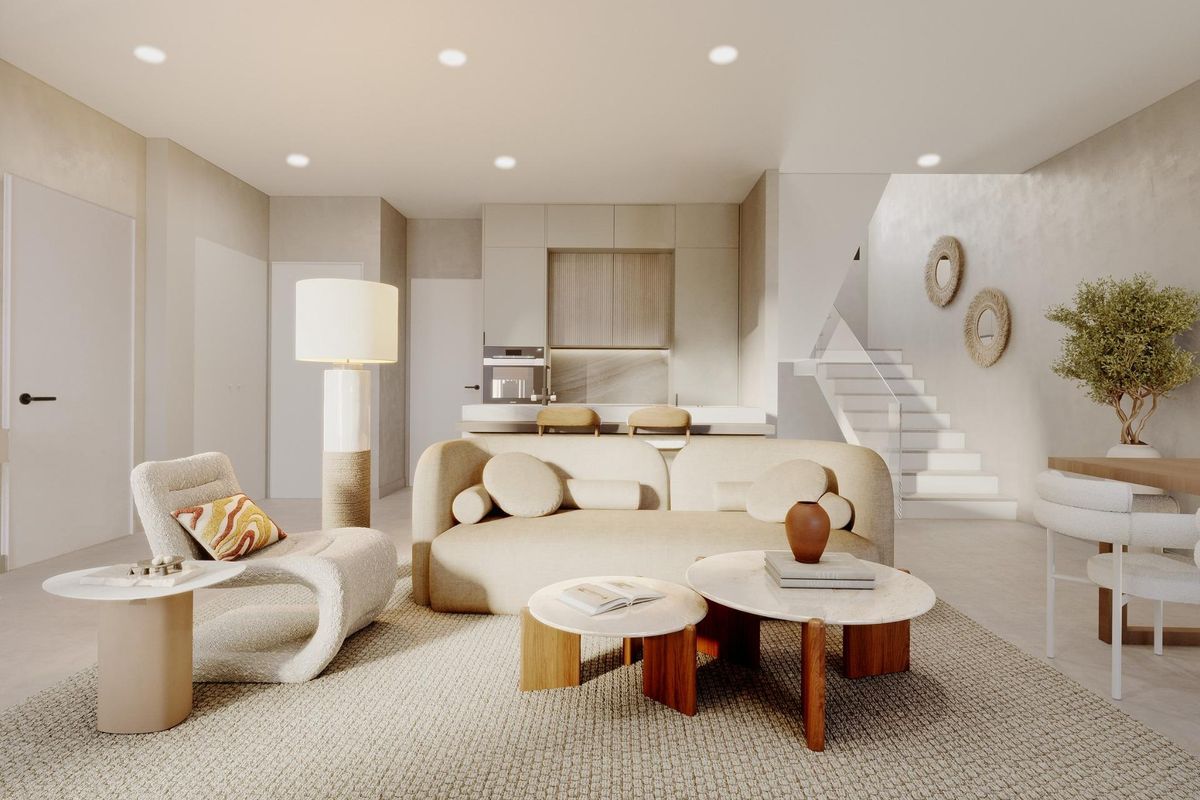 Stijlvolle woonkamer met modern meubilair en keuken in deze townhouse in Mojacar, helder en uitnodigend.