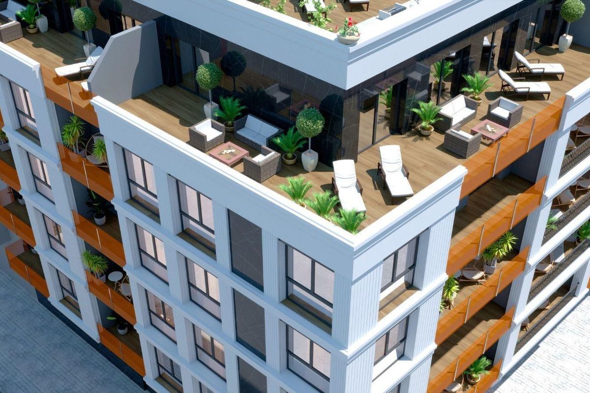 Luchtfoto van het penthouse gebouw met balkons en daktuin in Torrevieja, Spanje.