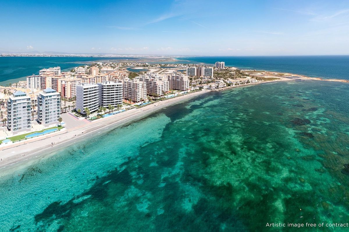 Coastal view of La Manga del Mar Menor highlighting rows of apartment buildings and the serene beachfront.