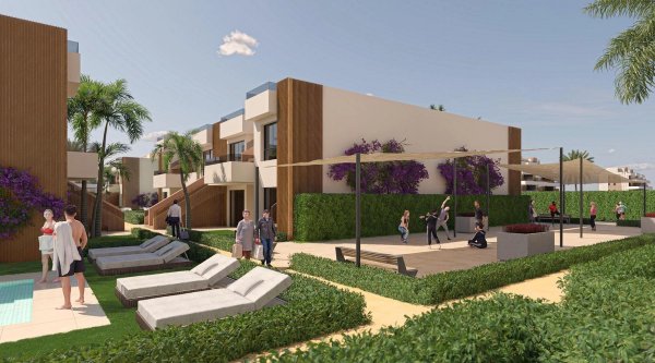 A vibrant community area in Alhama De Murcia with lounging spaces and palm trees near a modern bungalow complex.