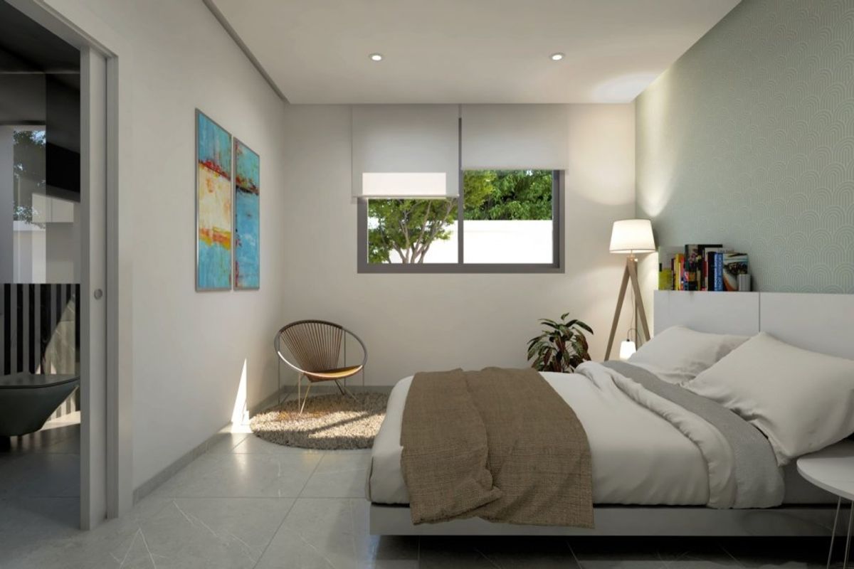 Stylish bedroom in Baños y Mendigo villa featuring modern decor and an adjoining bathroom.