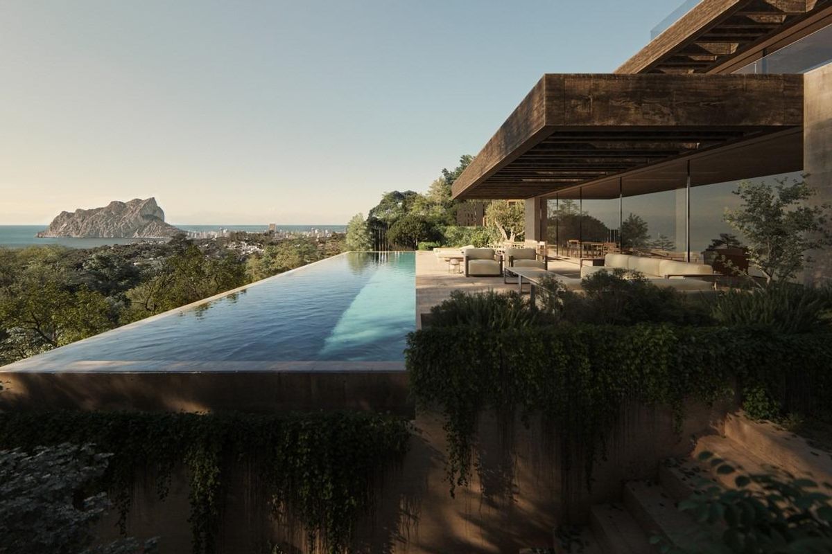 Prachtig uitzicht op het oneindige zwembad van de villa in Benissa, met uitzicht op de zee en bergen.