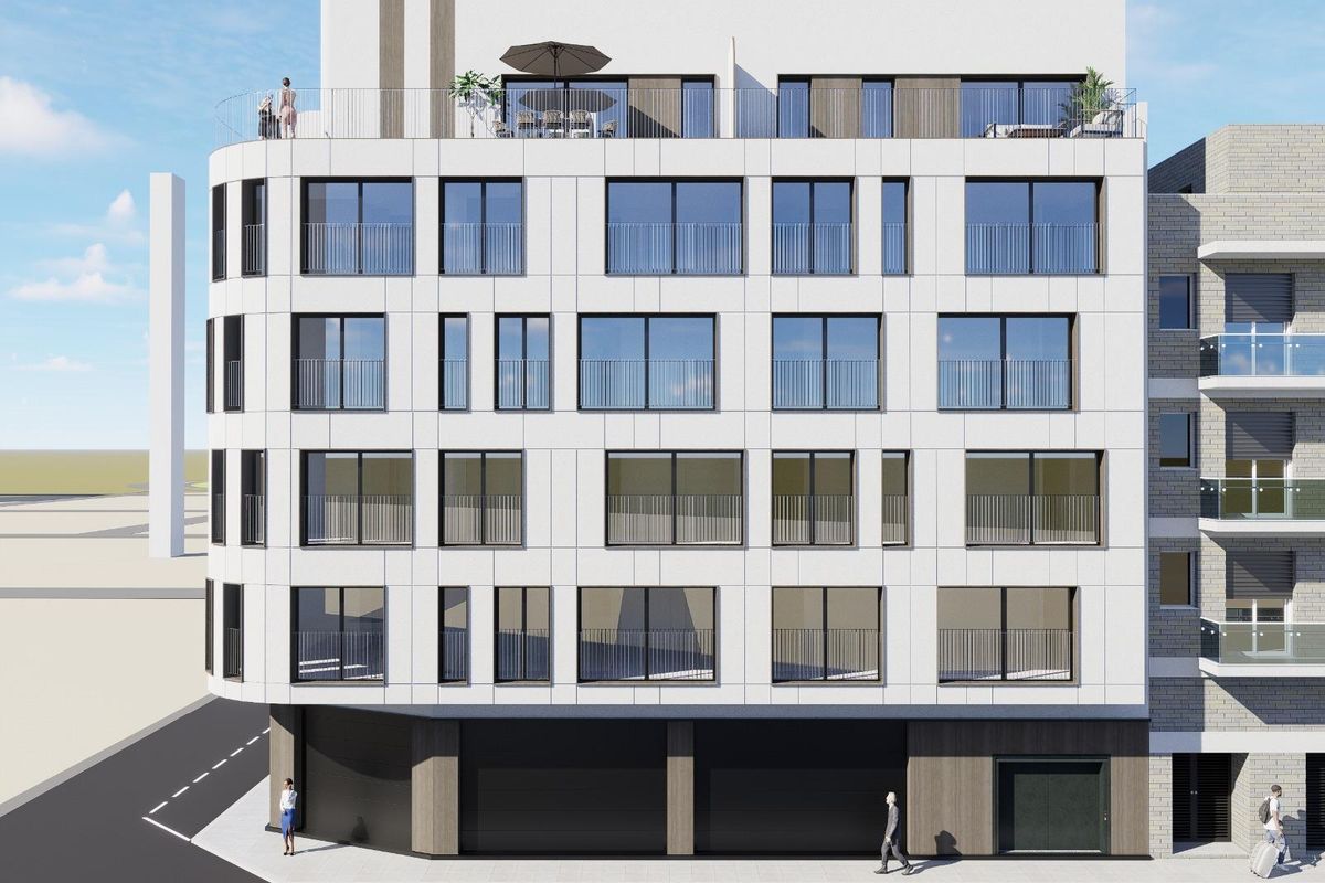 Buitenzicht van het penthousegebouw in Torrevieja, met uniek architectonisch ontwerp en balkons.