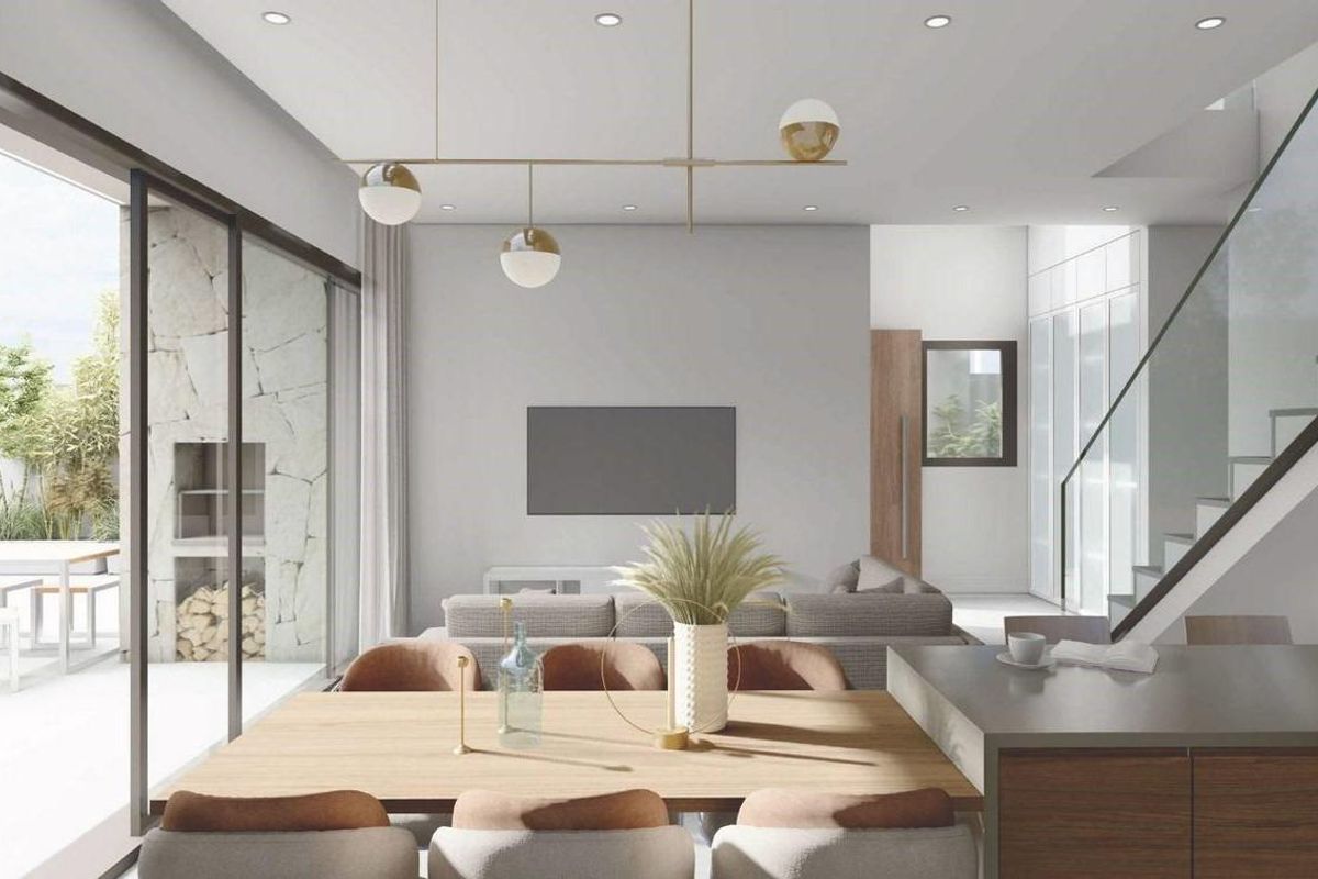 Open eetruimte en woonkamer met stijlvolle armaturen in een 3-slaapkamer villa in San Juan de los Terreros.