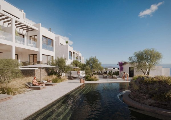 Appartementencomplex op de begane grond met zwembad en ligstoelen in Mojacar, Costa de Almeria.