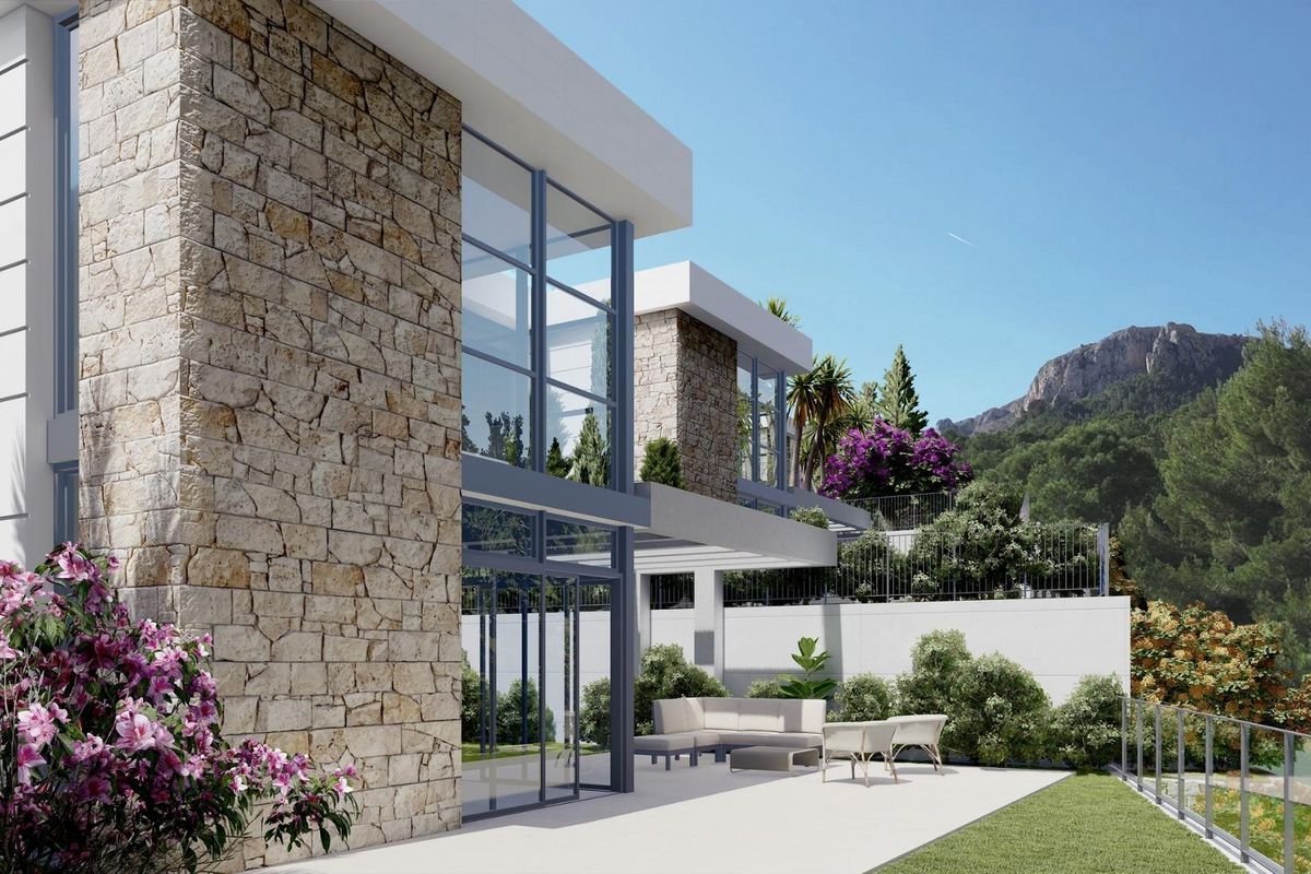 Modern villa ontwerp benadrukt door een weelderige tuin en een prachtig bergachtig uitzicht in Polop, Costa Blanca Noord.