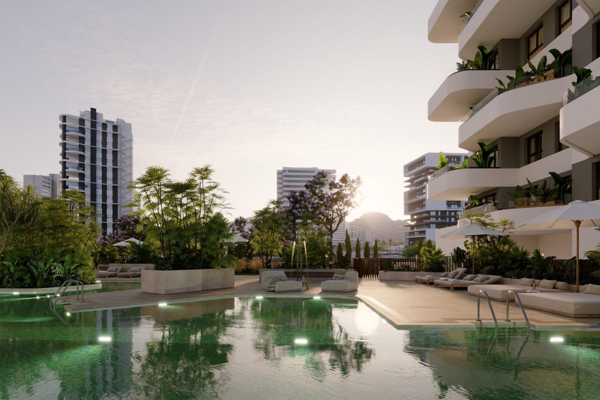 Sparkling pool area surrounded by lush greenery and modern architecture in Calpe, Costa Blanca North.