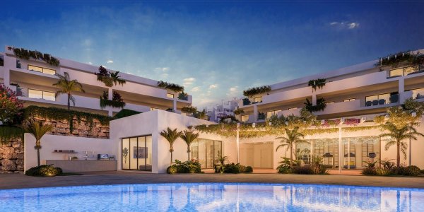 Buitenzicht op een modern appartementcomplex met zwembad, gelegen in Casares, Costa del Sol.