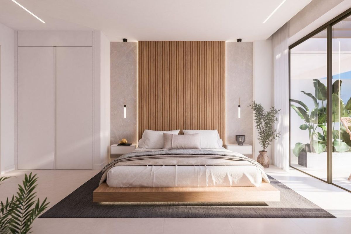 Hedendaagse slaapkamer met minimalistisch ontwerp en natuurlijk licht in het appartement in Estepona.