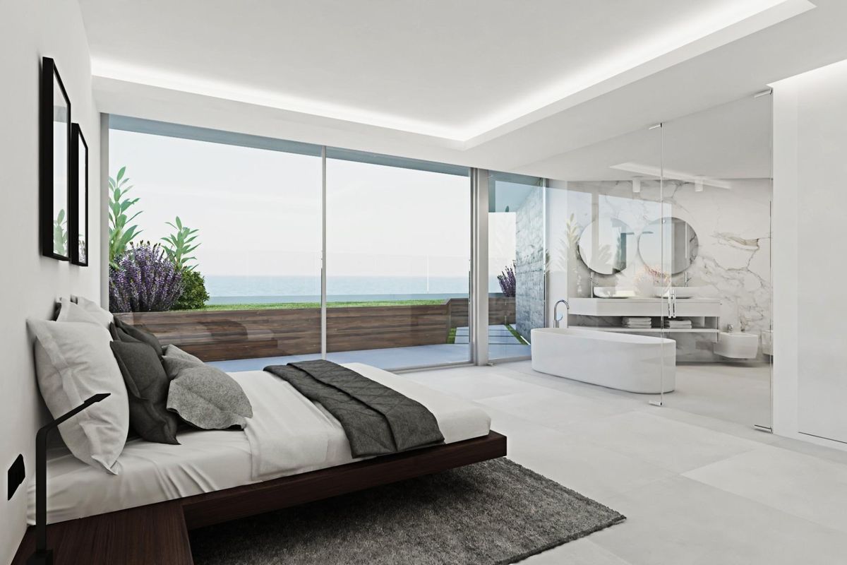 Elegante hoofdslaapkamer in een penthouse met 4 slaapkamers met uitzicht op de oceaan en een luxe ensuite in Calpe.