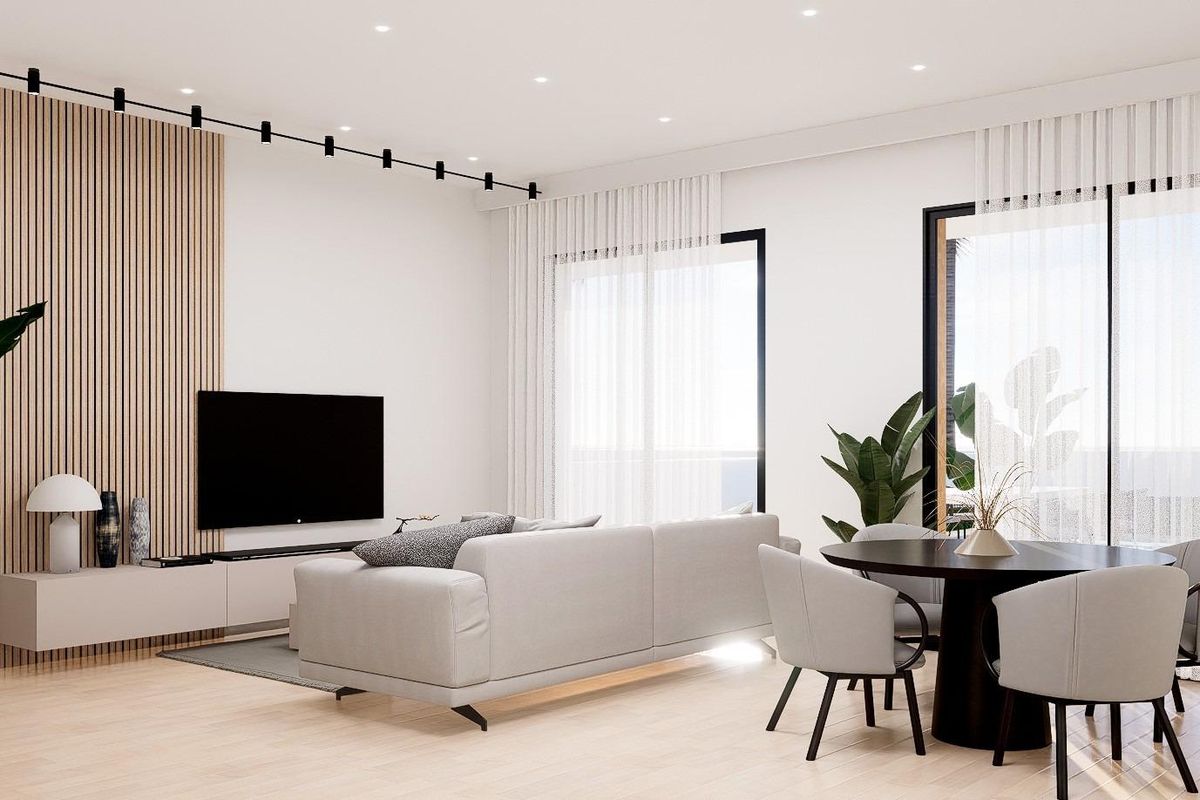 Heldere en luchtige woonkamer van een 3-slaapkamer townhouse in Orihuela Costa met moderne meubels en decor.