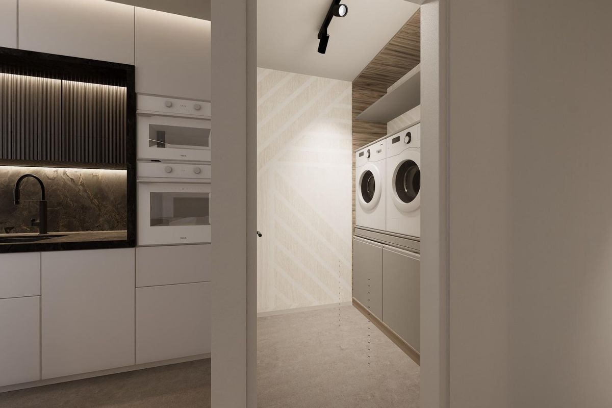 Moderne wasruimte in een 3-slaapkamer villa, Rojales, met strakke kasten en wasmachines.